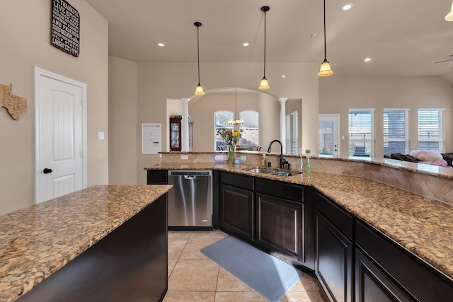 kitchen featuring a sink, stainless steel dishwasher, an inviting chandelier, and recessed lighting