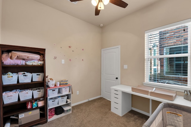 home office with baseboards, light carpet, and ceiling fan