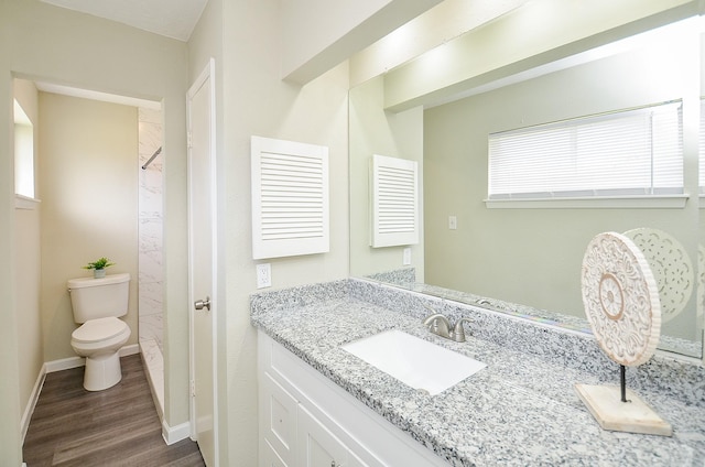 5343 Linda Ln, Katy, TX 77493 - full bathroom featuring baseboards, toilet, wood finished floors, and vanity