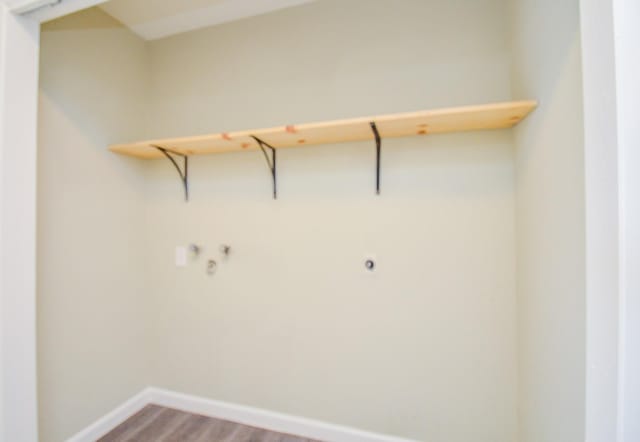 5343 Linda Ln, Katy, TX 77493 - washroom featuring electric dryer hookup, baseboards, light wood-style floors, and laundry area