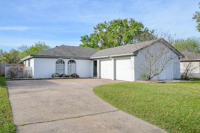 5343 Linda Ln, Katy, TX 77493 - ranch-style home featuring a front lawn, an attached garage, brick siding, and driveway
