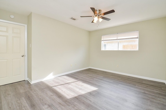 5343 Linda Ln, Katy, TX 77493 - empty room featuring visible vents, baseboards, ceiling fan, and wood finished floors