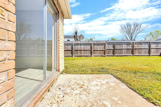 view of yard featuring a patio area and fence