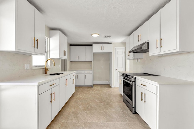 kitchen featuring visible vents, under cabinet range hood, a sink, white cabinetry, and stainless steel electric range