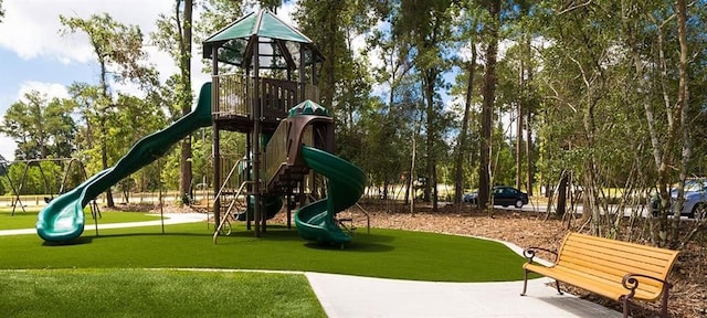 community jungle gym with a yard