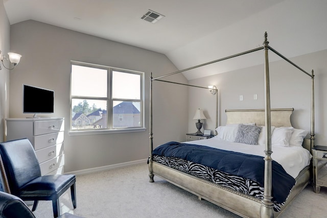 bedroom with lofted ceiling, baseboards, visible vents, and carpet floors