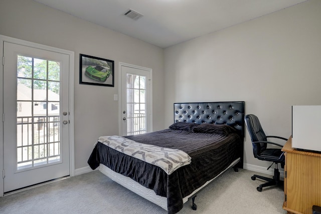 bedroom with visible vents, carpet flooring, and baseboards