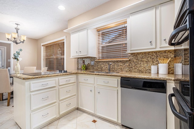 kitchen featuring a sink, a peninsula, an inviting chandelier, black electric stovetop, and dishwasher