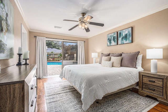 bedroom featuring visible vents, access to exterior, wood finished floors, crown molding, and ceiling fan