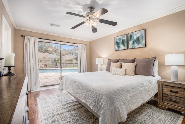 bedroom with access to exterior, visible vents, crown molding, ceiling fan, and wood finished floors