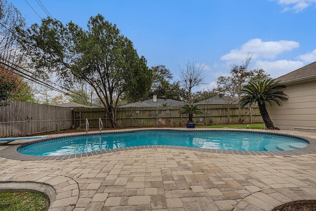 view of pool featuring a patio and a fenced backyard