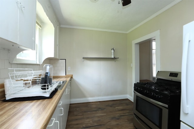 kitchen with dark wood-style floors, white cabinetry, freestanding refrigerator, butcher block counters, and gas range