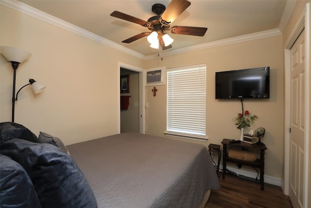 bedroom featuring baseboards, dark wood finished floors, ceiling fan, ornamental molding, and a closet