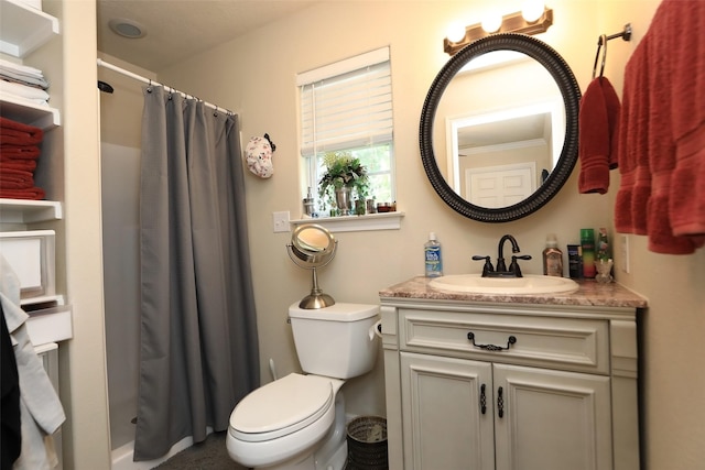 bathroom with curtained shower, toilet, and vanity