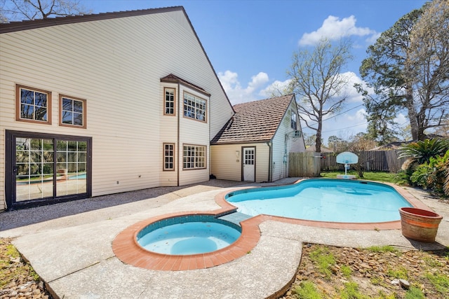 view of pool featuring a fenced in pool, a patio, an in ground hot tub, and a fenced backyard