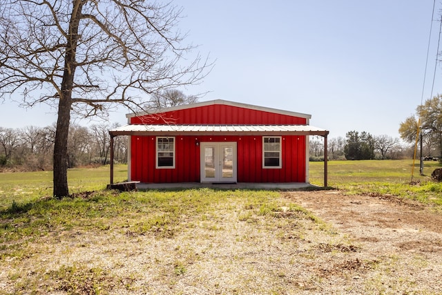 view of outdoor structure featuring an outbuilding and french doors