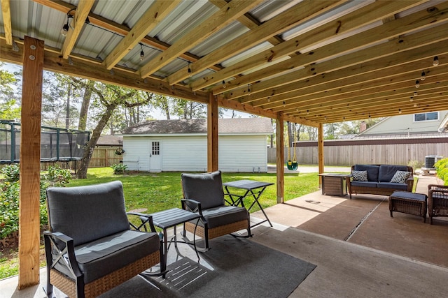 view of patio with cooling unit, a fenced backyard, an outdoor structure, outdoor lounge area, and a trampoline