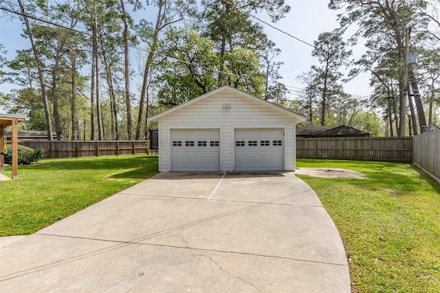 detached garage featuring fence