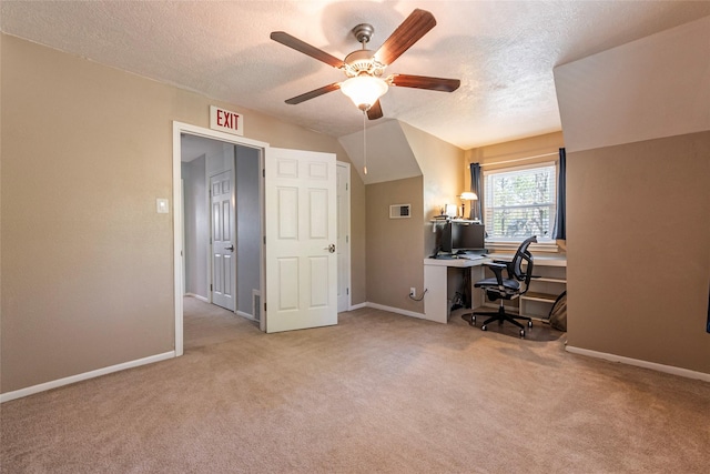 home office featuring light carpet, baseboards, a textured ceiling, and a ceiling fan