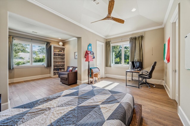 bedroom featuring lofted ceiling, crown molding, baseboards, and wood-type flooring