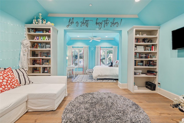 bedroom with wood finished floors, recessed lighting, crown molding, baseboards, and vaulted ceiling