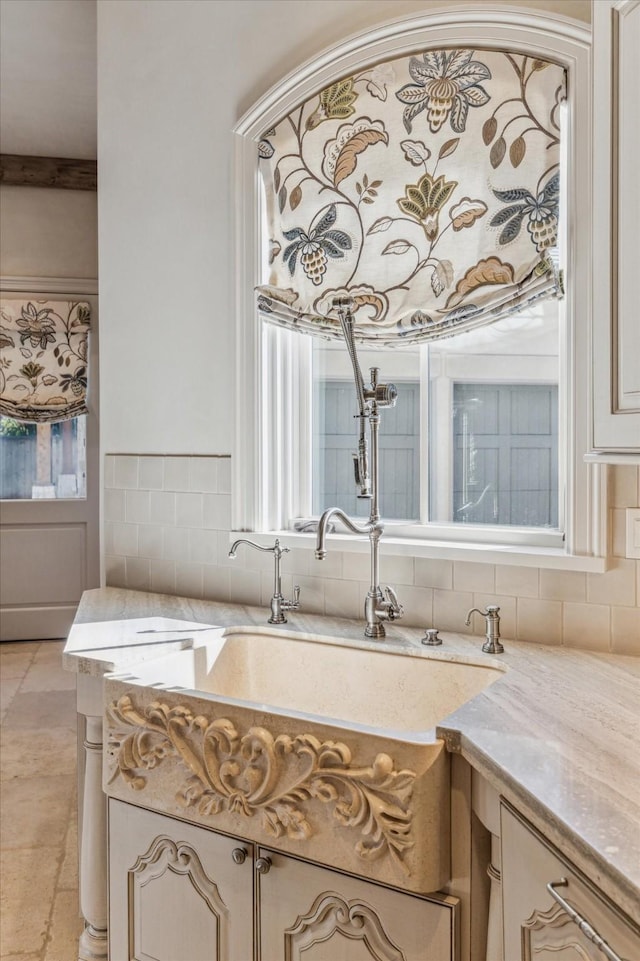 interior space with tasteful backsplash and vanity