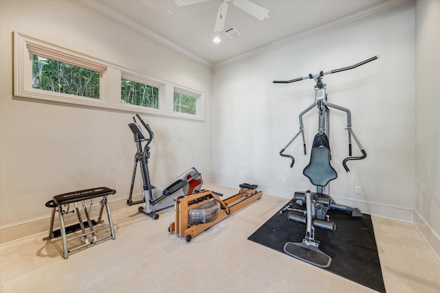 workout room featuring visible vents, a ceiling fan, baseboards, and ornamental molding