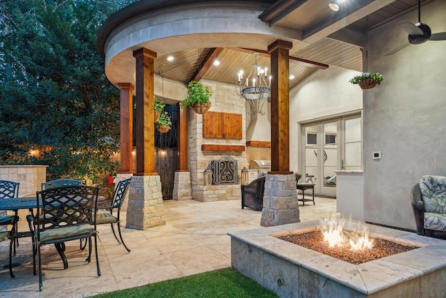 view of patio with outdoor dining space and an outdoor stone fireplace