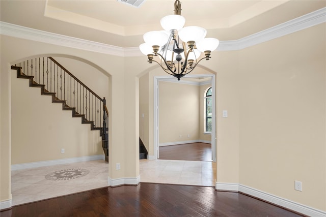 12530 Sharps Ln, Magnolia, TX 77354 - entryway with a chandelier, hardwood / wood-style floors, a tray ceiling, stairs, and ornamental molding