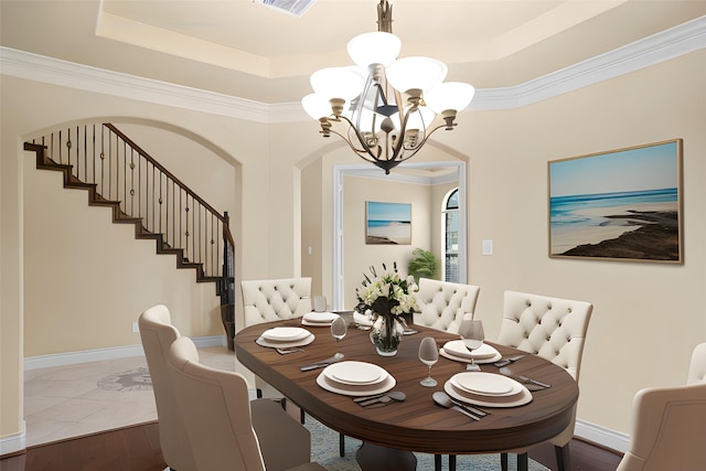12530 Sharps Ln, Magnolia, TX 77354 - dining area with a chandelier, a tray ceiling, baseboards, stairway, and ornamental molding