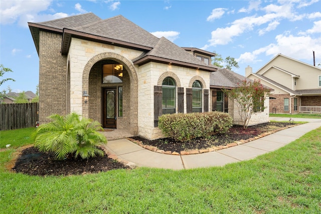 12530 Sharps Ln, Magnolia, TX 77354 - view of front of house with brick siding, a shingled roof, and stone siding