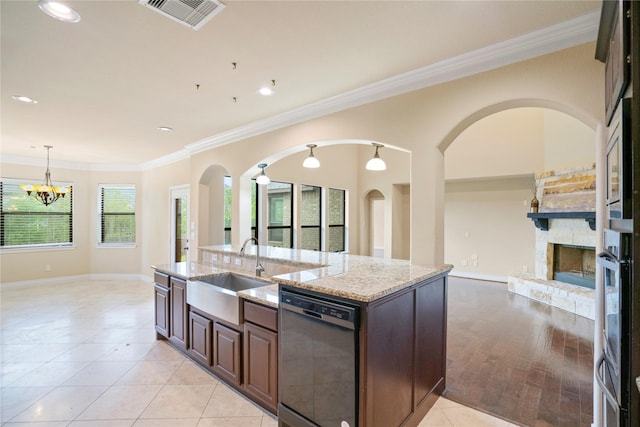 12530 Sharps Ln, Magnolia, TX 77354 - kitchen featuring black dishwasher, a sink, open floor plan, a fireplace, and ornamental molding