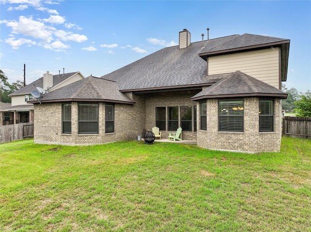 12530 Sharps Ln, Magnolia, TX 77354 - rear view of property with brick siding, a chimney, a patio, and roof with shingles