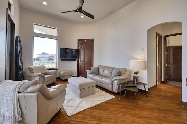 4206 Turks Pt, Galveston, TX 77554 - living area with a ceiling fan, wood finished floors, recessed lighting, arched walkways, and baseboards