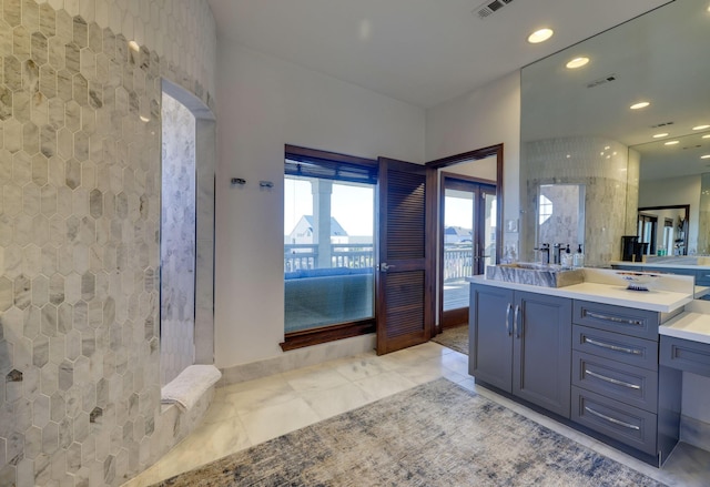 4206 Turks Pt, Galveston, TX 77554 - full bathroom featuring recessed lighting, visible vents, tiled shower, and vanity