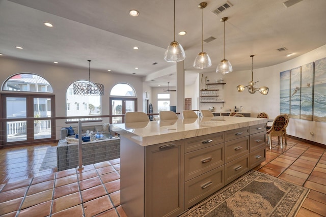 4206 Turks Pt, Galveston, TX 77554 - kitchen featuring visible vents, a center island, decorative light fixtures, light countertops, and recessed lighting