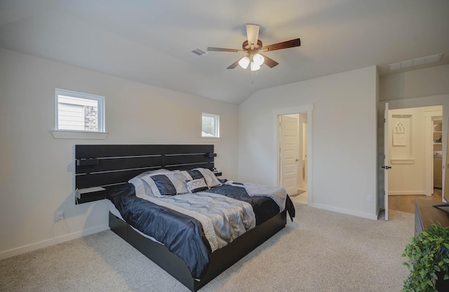 carpeted bedroom featuring vaulted ceiling, multiple windows, baseboards, and visible vents