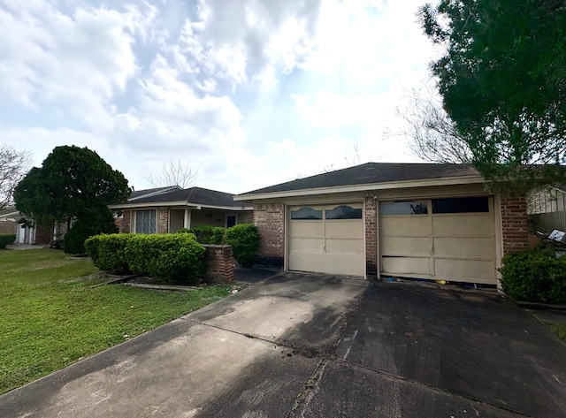 single story home with driveway, an outdoor structure, a front yard, a garage, and brick siding