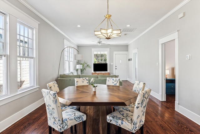 dining room featuring visible vents, baseboards, dark wood-type flooring, and ornamental molding