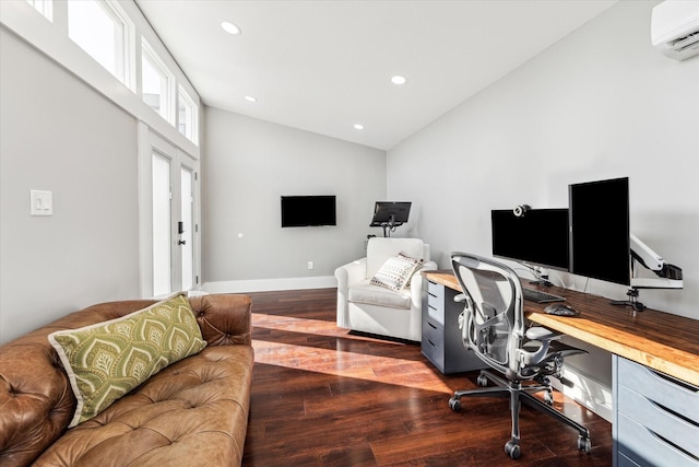 office area with baseboards, lofted ceiling, a wall unit AC, recessed lighting, and wood finished floors