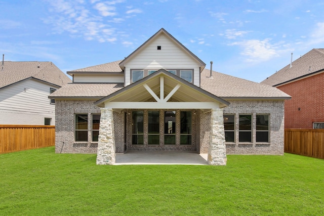 8407 Sheffields Leader, Fulshear, TX 77441 - back of house featuring a patio, a fenced backyard, a shingled roof, and brick siding