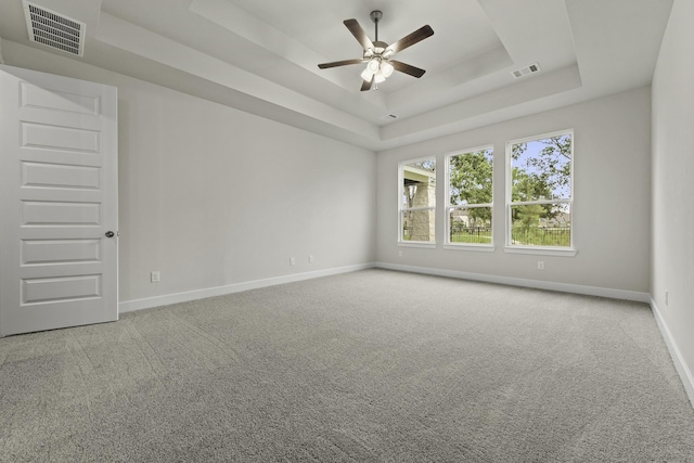 8407 Sheffields Leader, Fulshear, TX 77441 - empty room with a ceiling fan, a tray ceiling, and carpet floors