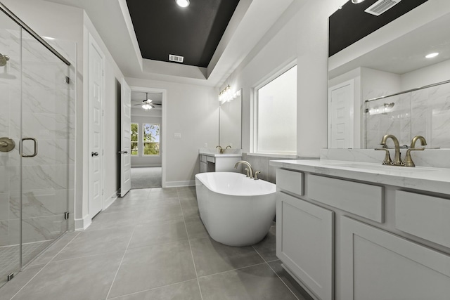8407 Sheffields Leader, Fulshear, TX 77441 - full bathroom featuring two vanities, a marble finish shower, a freestanding bath, a ceiling fan, and recessed lighting