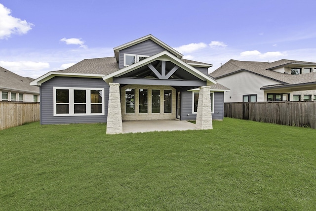 8407 Sheffields Leader, Fulshear, TX 77441 - back of property with a fenced backyard, a patio area, and a shingled roof