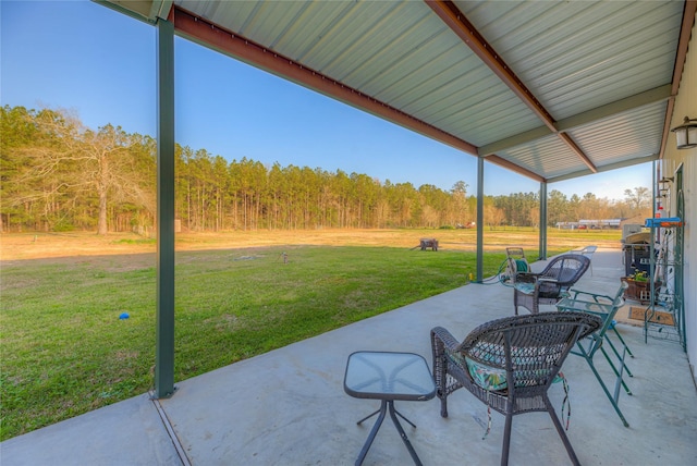 view of patio / terrace featuring a forest view