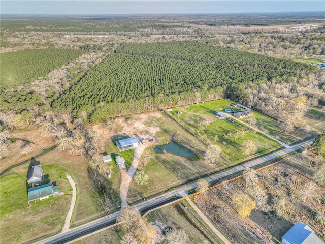 birds eye view of property with a rural view