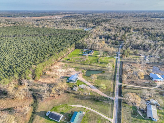 birds eye view of property with a rural view and a view of trees