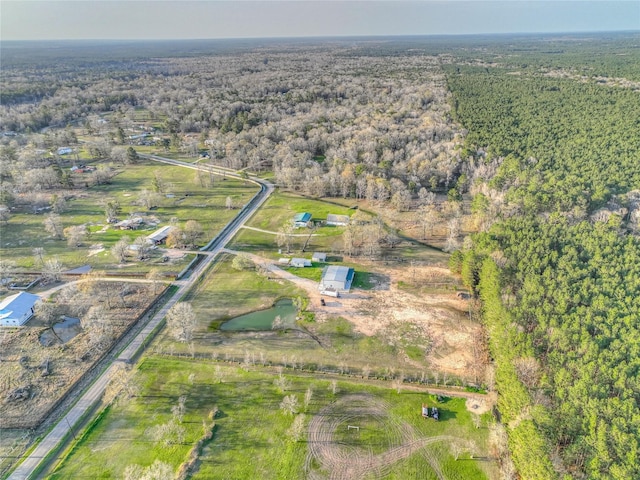 bird's eye view featuring a rural view and a forest view