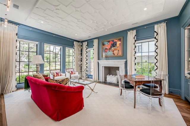2131 Brentwood Dr, Houston, TX 77019 - living room with a fireplace with flush hearth, wood finished floors, and ornamental molding