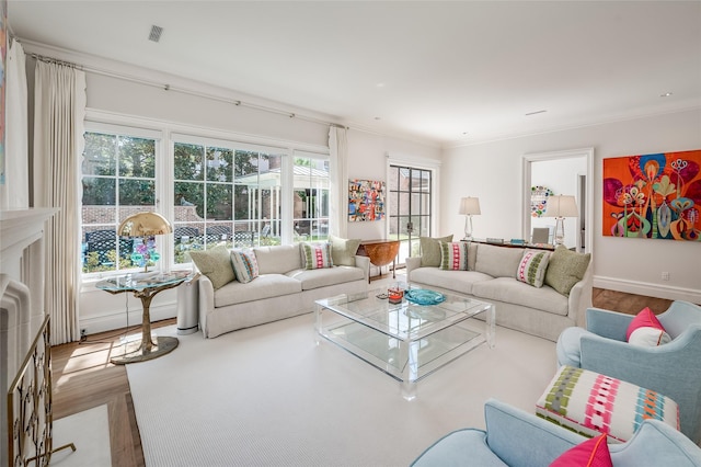 2131 Brentwood Dr, Houston, TX 77019 - living room with wood finished floors, baseboards, and ornamental molding